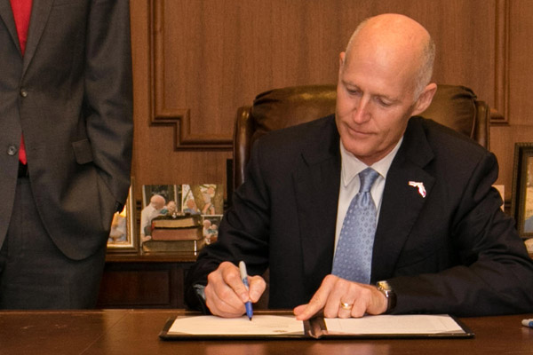 Rick Scott Signs Nearly $1 Billion Tax Cut Package Into Law